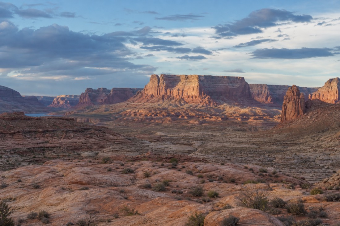Vast Glen Canyon sandstone landscape with towering rock formations under a wide sky
